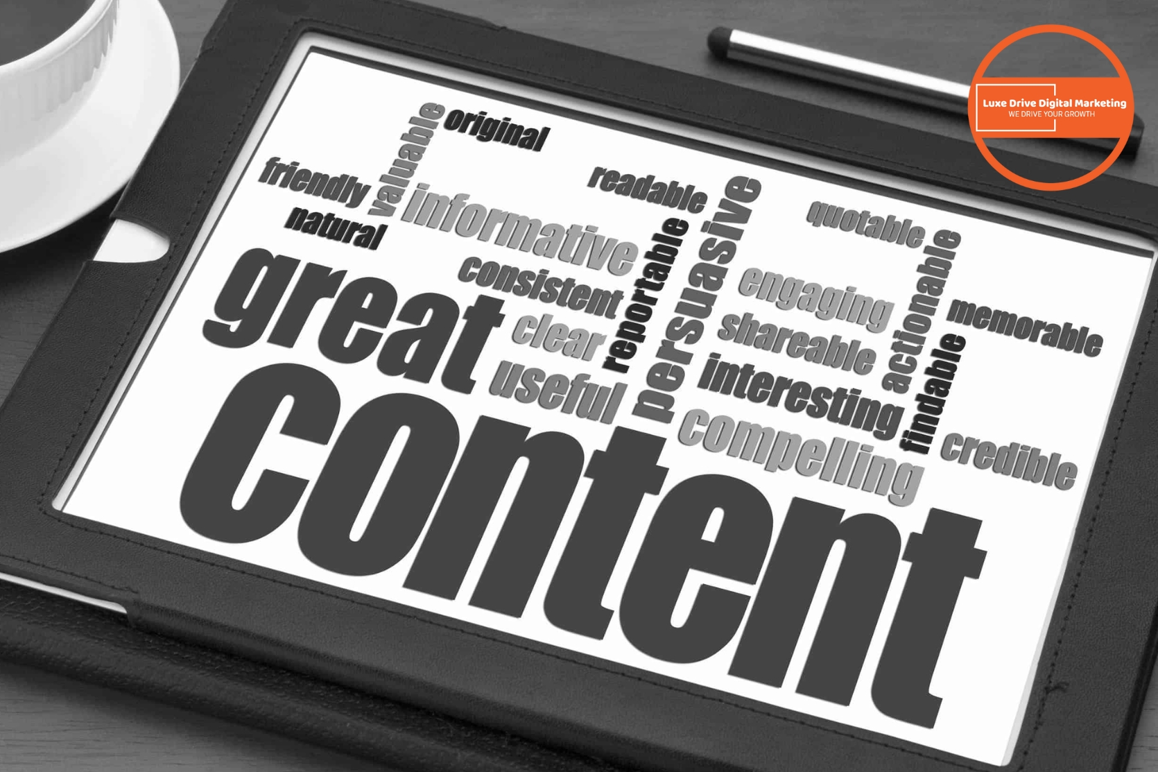 Luxe Drive Digital Marketing America&#039;s Top Marketing Agency A tablet displays a word cloud centered on “great content,” surrounded by related terms such as informative, persuasive, readable, and credible. Luxe Drive Digital Marketing We Drive Your Growth